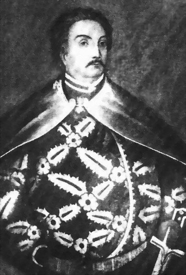 Schwarzes und weißes Foto von Papst Johannes Paul II. in Priestergewändern, der eine schwarze Robe mit weißem Kragen und Manschetten trägt, die Hände gefaltet, strenger Gesichtsausdruck, direkter Blick.