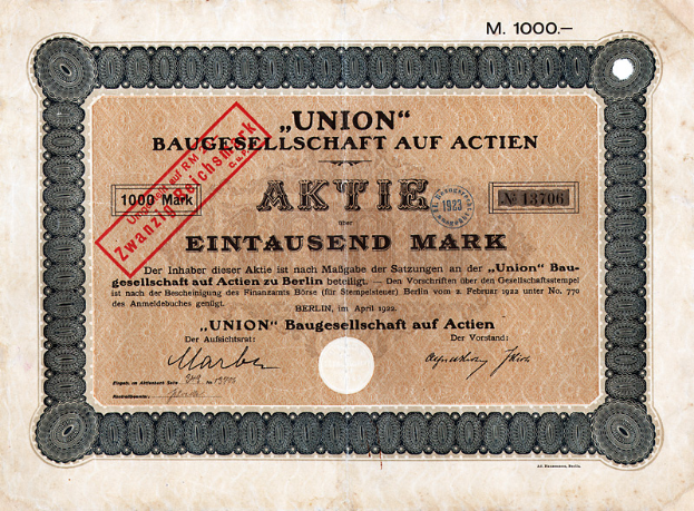 Ein altes deutsches Banknoten mit einem roten Stempel und Text, der darauf hinweist, dass es sich um eine Aktie handelt.