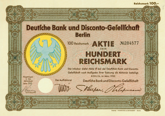 Eine alte deutsche Banknote mit einer Vogeldarstellung und der Aufschrift "Deutsche Bank und Disconto-Gesellichaft Berlin".