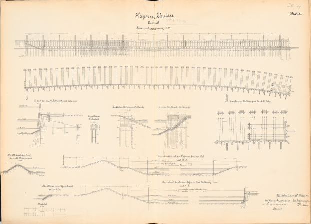 Offenes Buch mit detaillierten Zeichnungen und Texten eines Schienensystems, einschließlich einer Illustration einer Eisenbahnschiene.