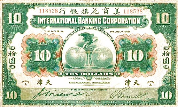 Ein alter Zehn-Dollar-Banknote der International Banking Corporation mit einem grün-weißen Farbschema, auf dem die Wörter "International Banking Corporation" in fetter schwarzer Schrift oben und die Zahl 10 in der Mitte stehen, umgeben von einem dekorativen Rahmen.
