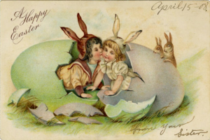 Altmodische Ostern-Postkarte mit zwei Kindern in einem Ei mit zwei Kaninchen und Begleittext, der einen fröhlichen Ostergrüß wünscht.